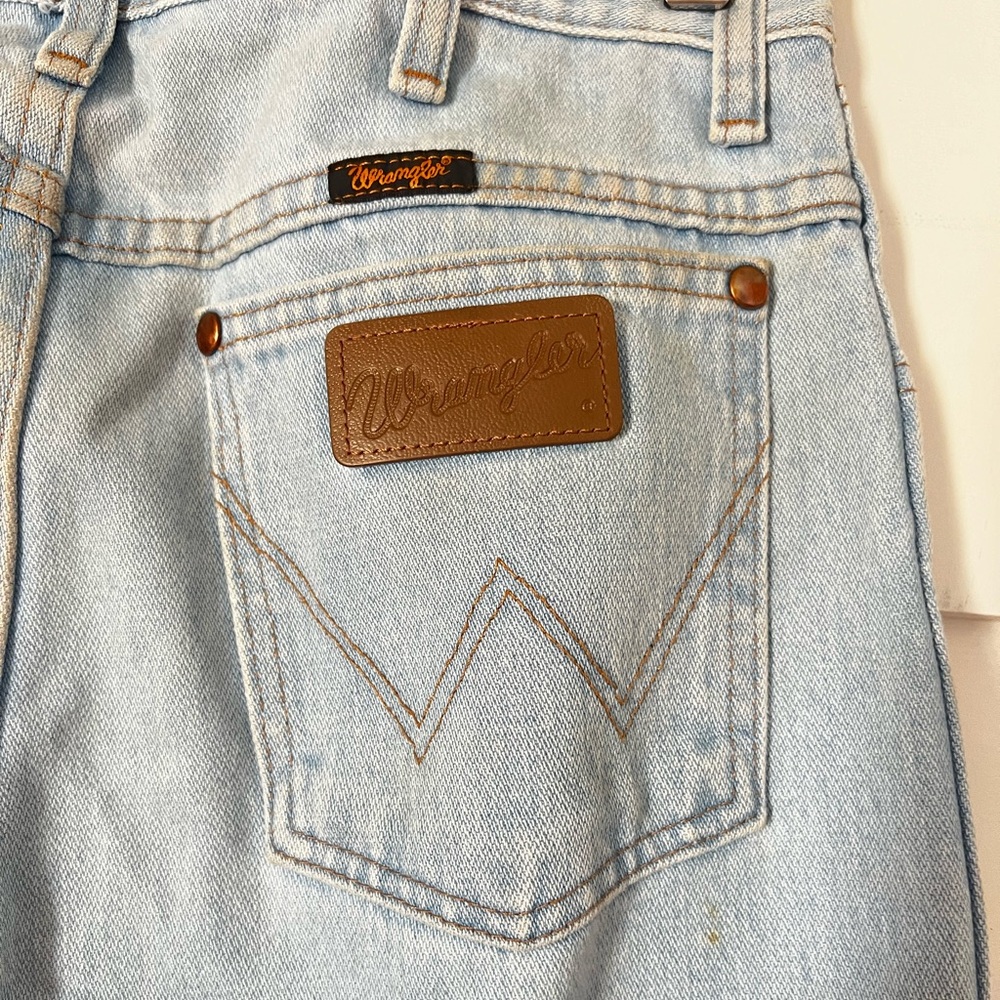 Vintage light wash Wranglers.